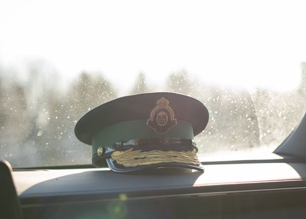 Standard issue SMS hat sitting on the dash of a cruiser